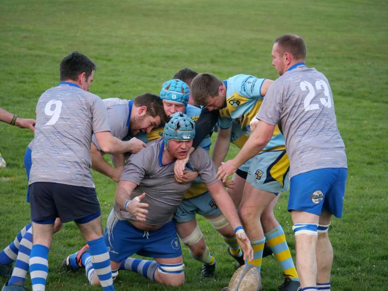 Adam Clark looks to nick possession